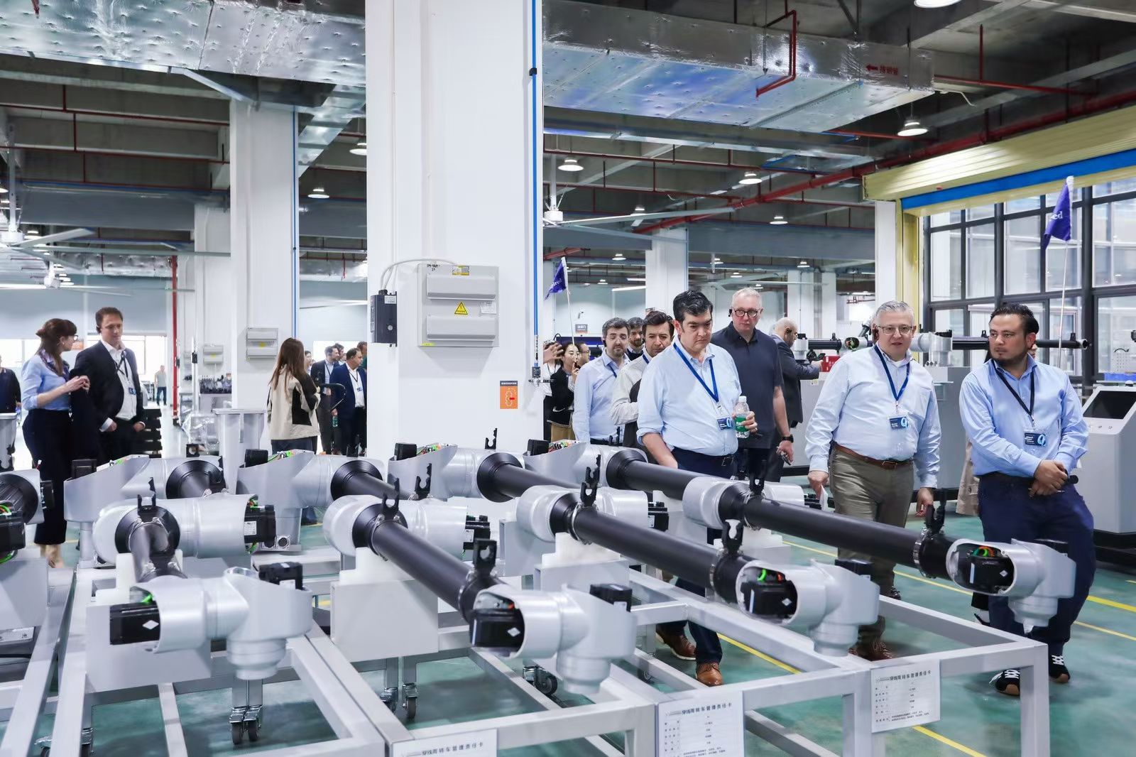 Customers visiting the collaborative robot production area